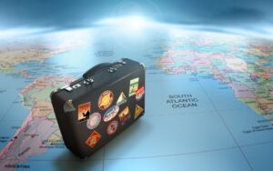 suitcase with visited countries stamps on a map