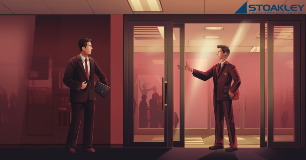 an employer beckons a job candidate to enter their offices but the candidate is hesitant, unwilling to go back to in-person work, favouring remote work/working from home