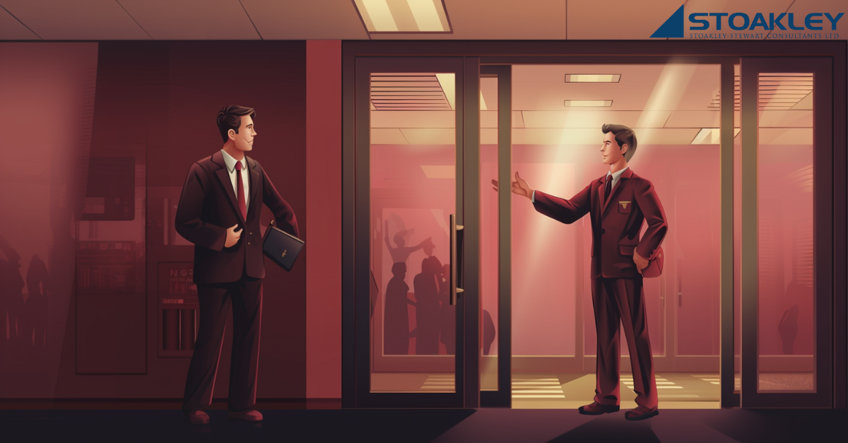 an employer beckons a job candidate to enter their offices but the candidate is hesitant, unwilling to go back to in-person work, favouring remote work/working from home